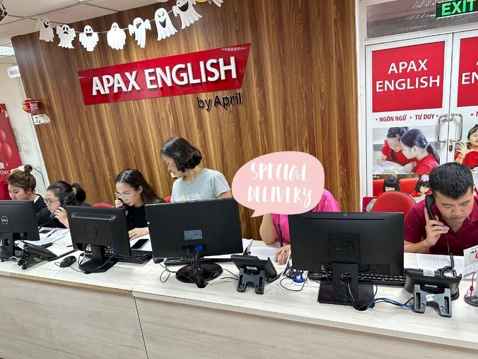 A group of people sitting at a table with computers
Description automatically generated with medium confidence