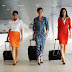 3 different malaysia airlines stewardesses walks together