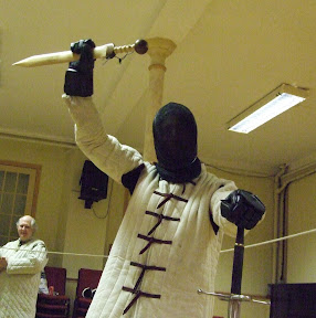  Dawn Duellists longsword fencer holds trophy aloft