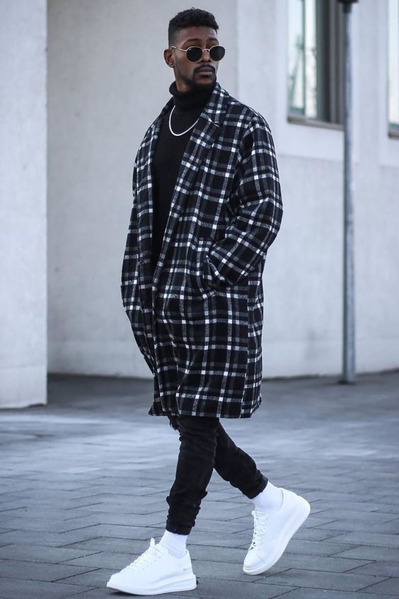 man layering his men’s urban clothing with an over coat