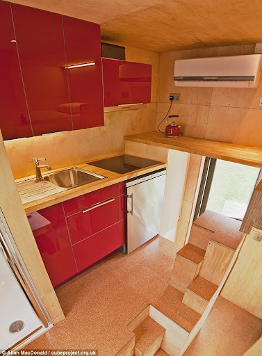 10ft cube home that includes a lounge, a shower, a kitchen and a DOUBLE bedroom