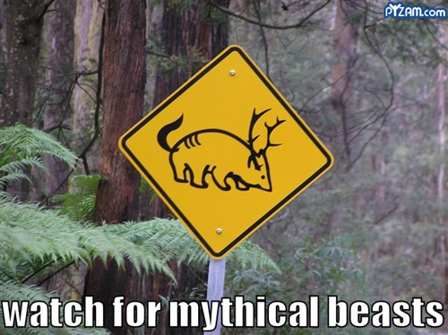 funny road sign warning of mythical creatures