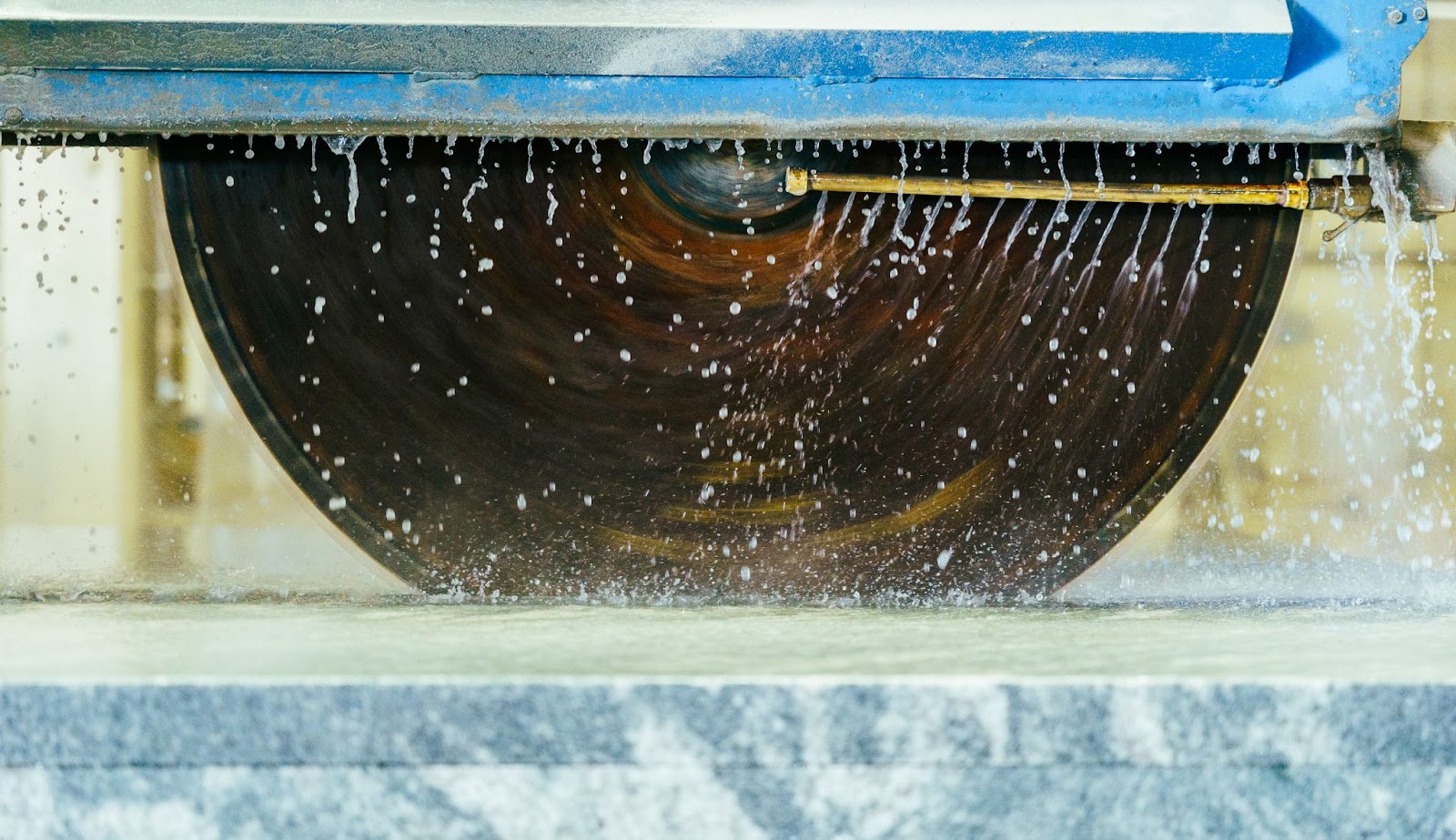 Fabrication photo of saw cutting stone