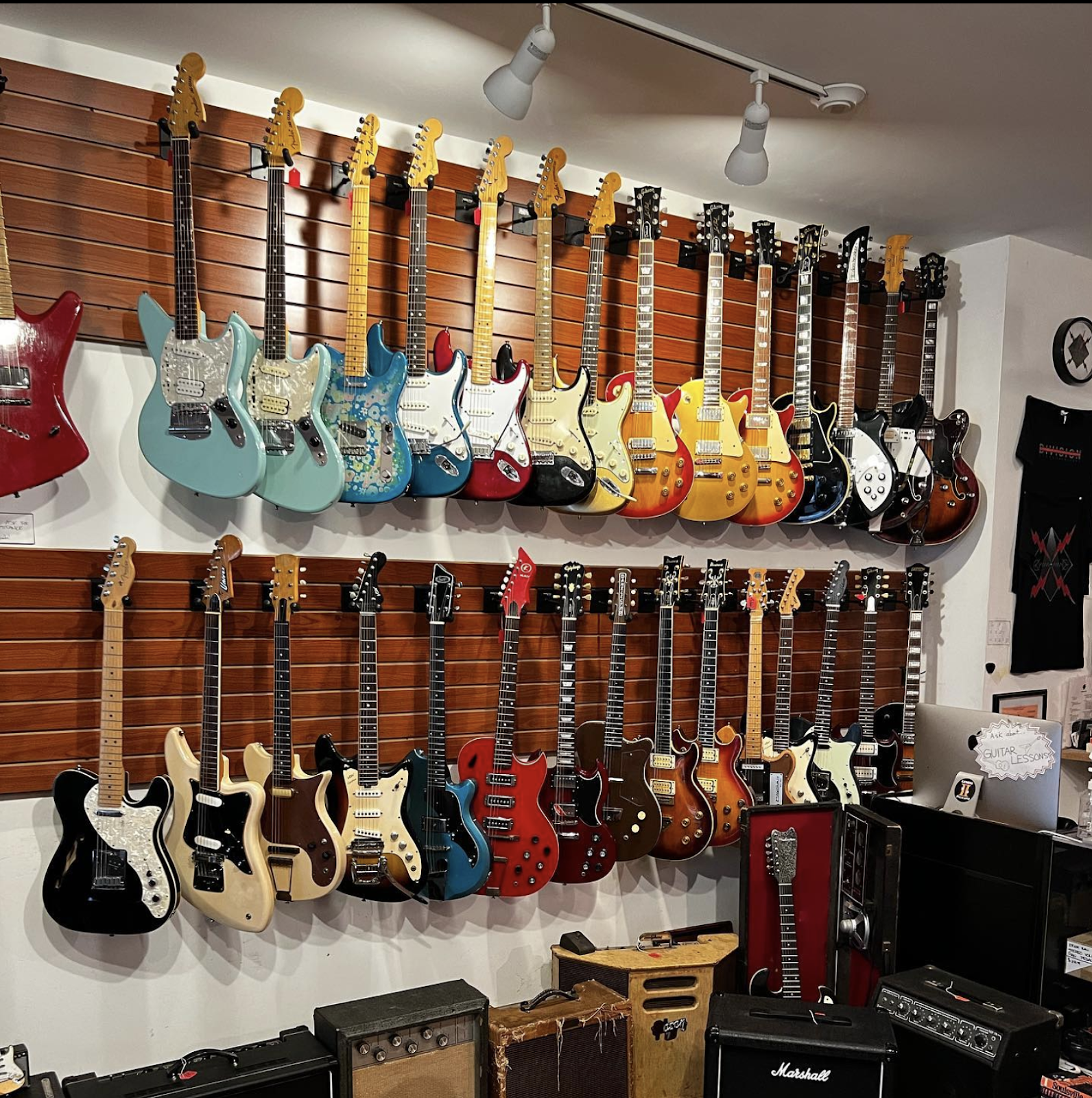 Owner Paul DeCourcey keeps Division Street Guitars stocked with anywhere from 75-100 used guitars at any given time