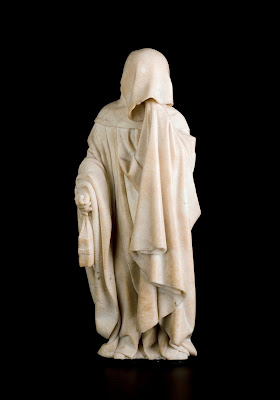 Jean de la Huerta and Antoine le Moiturier, Mourner with Cowl Pulled Down, Holding a Book in His Right Hand and with His Left Hand Wiping His Tears on His Cloak, no. 51, 1443–56/57, alabaster, 16 1/16 x 7 1/16 x 5 15/16 in,. Musée des Beaux-Arts, Dijon