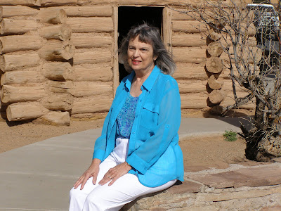 Vera Maire in front of hogan built in front of Tuba City Trading Post.