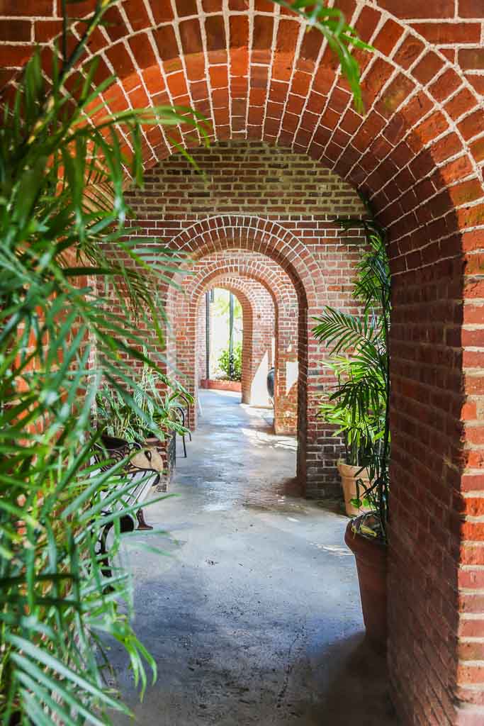 Key West Garden Club and West Martello Tower have cool arches that repeat, seen in this photo. The arches are accented by greenery.