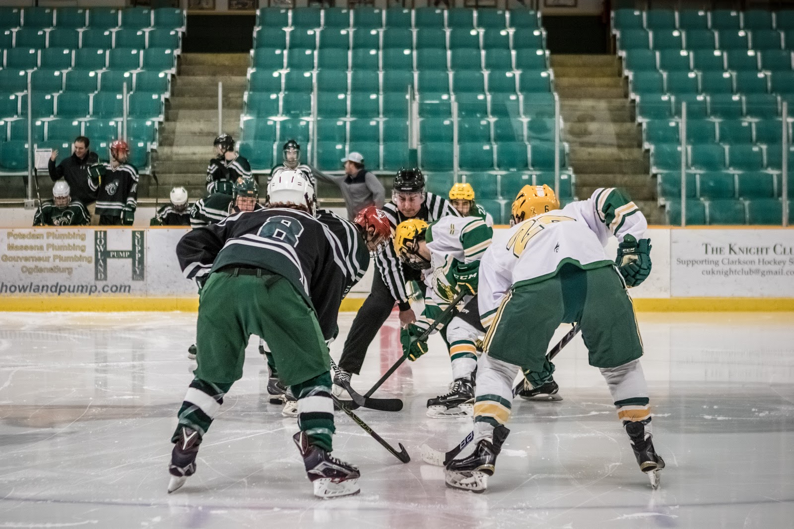 Players from Clarkson University Men's club hockey prepare for a face-off against an opponent. 