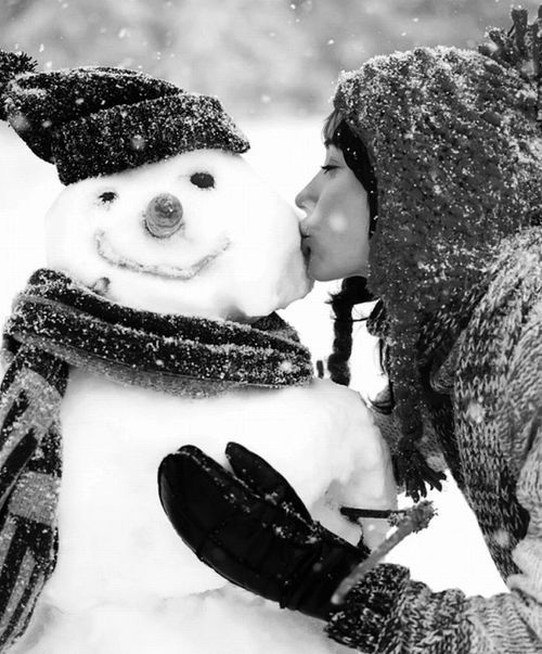 person kissing snowman