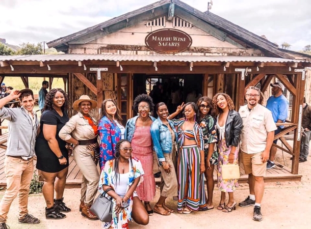 Visitors pose for a photo at Malibu Wine Safaris in Malibu, CA.