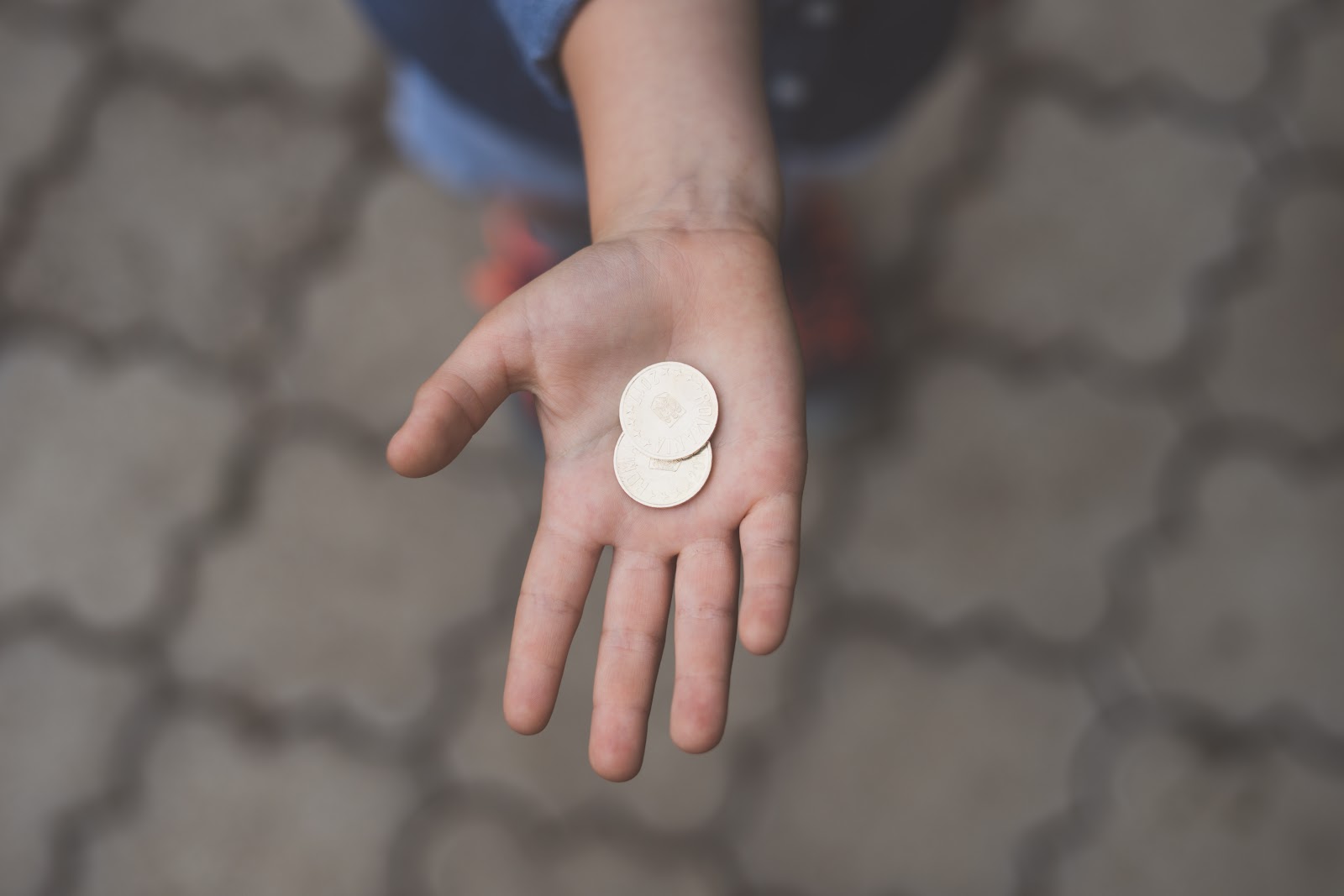 Person holding coins.