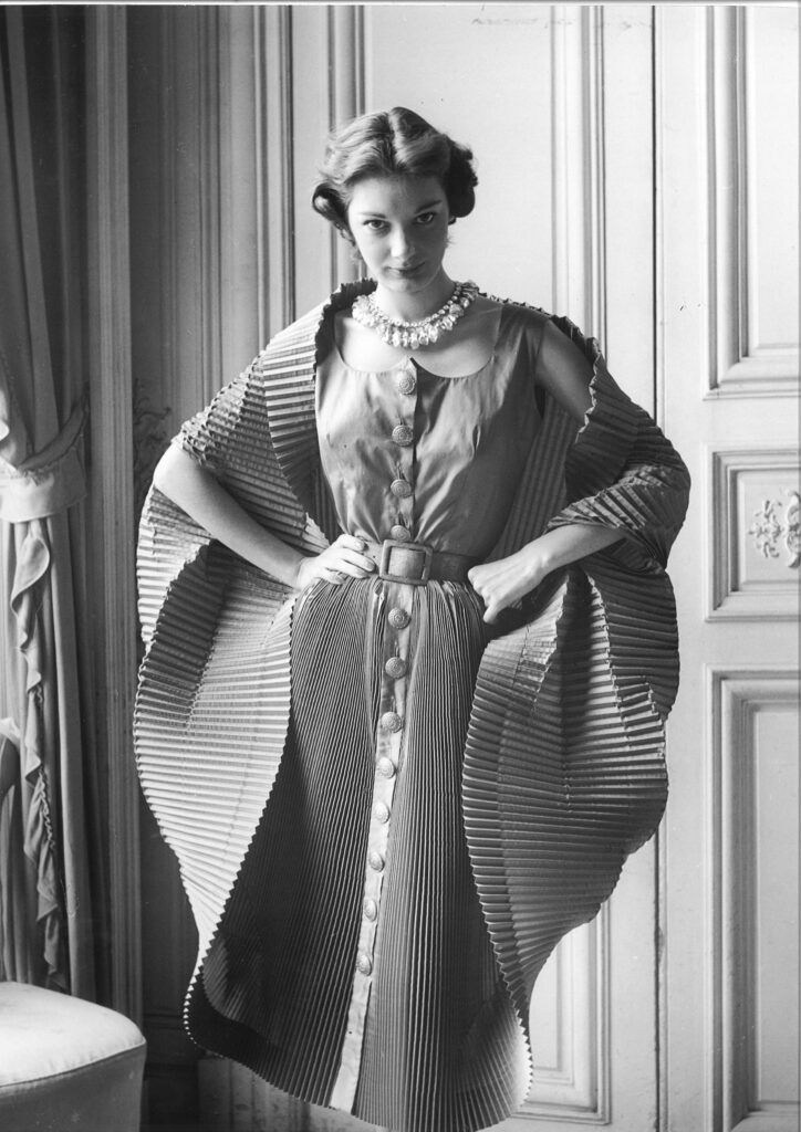Elsa Schiaparelli, Finely Plisséd Dress opened in a Cocoon, 1951.