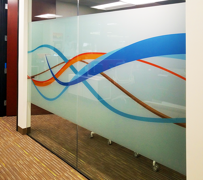 A smart glass window can be incorporated into commercial and corporate settings. Source: scantechgraphics.com