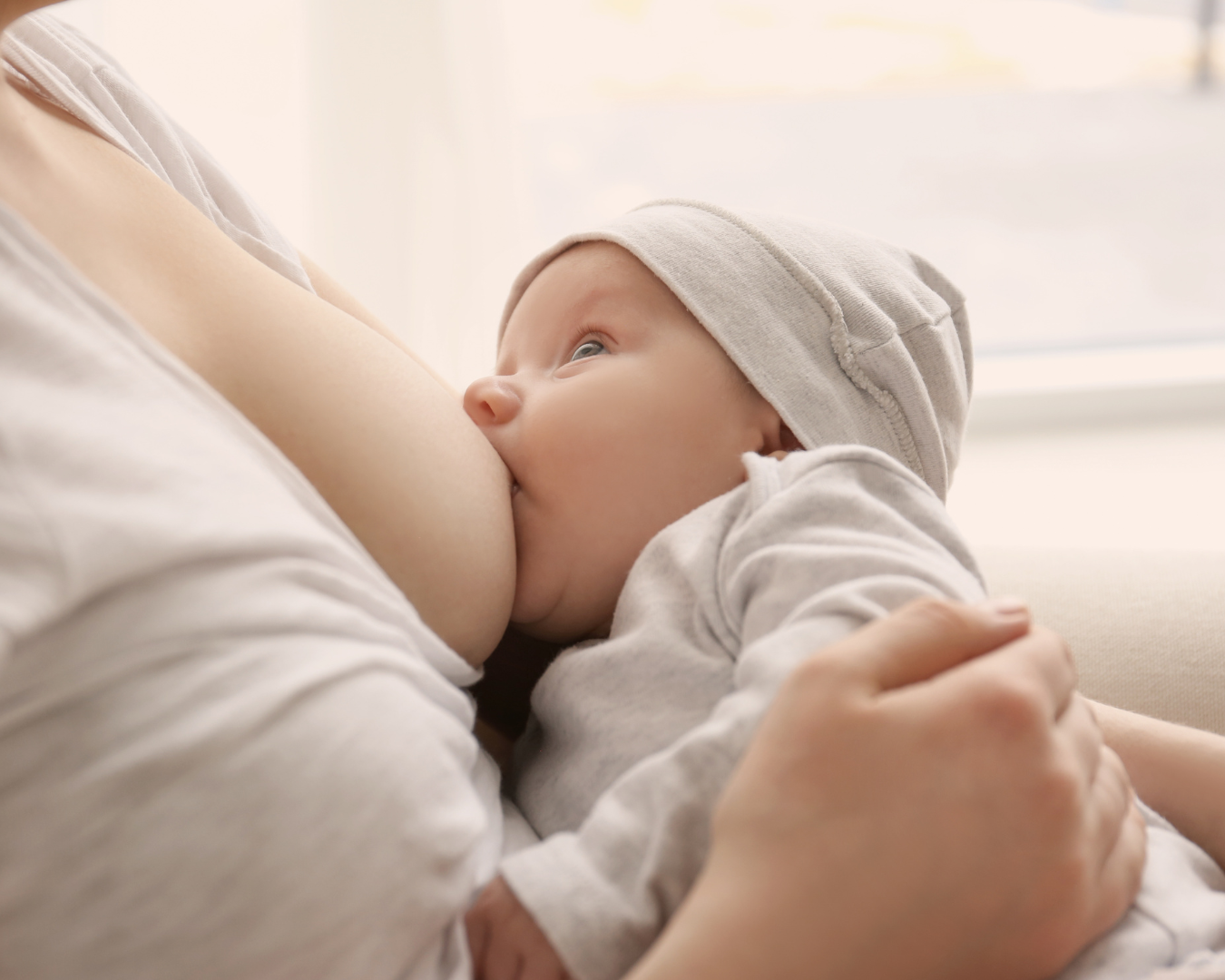 mother breastfeeding her newborn