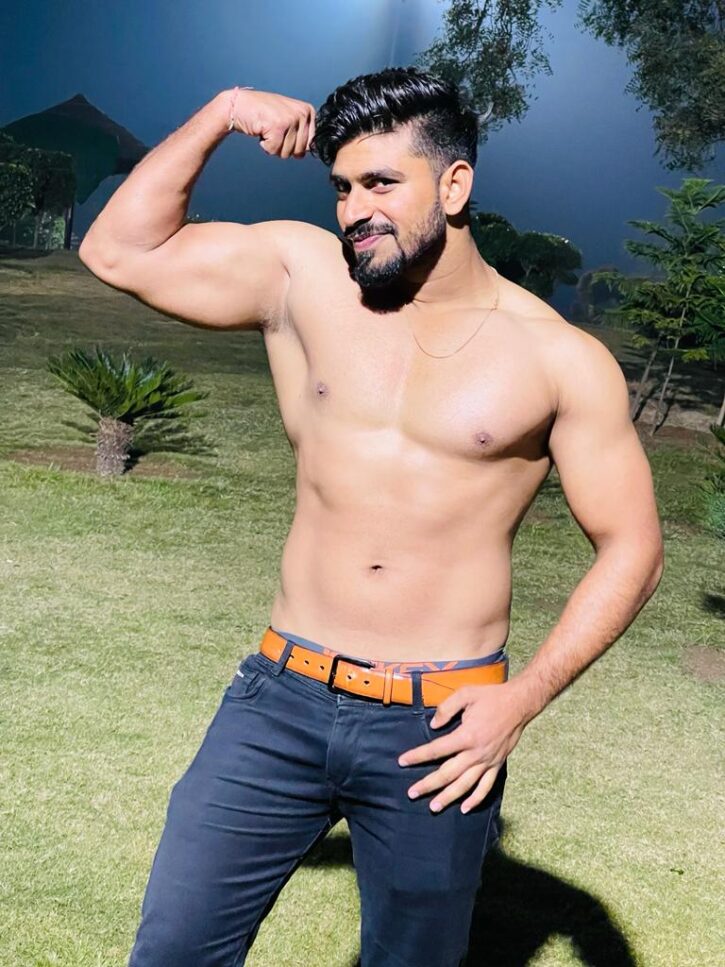 MasterJenny smiling and posing at night in a field in jeans shirtless