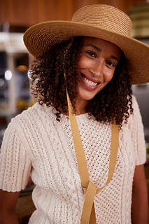 woman wearing short sleeve cable knit top