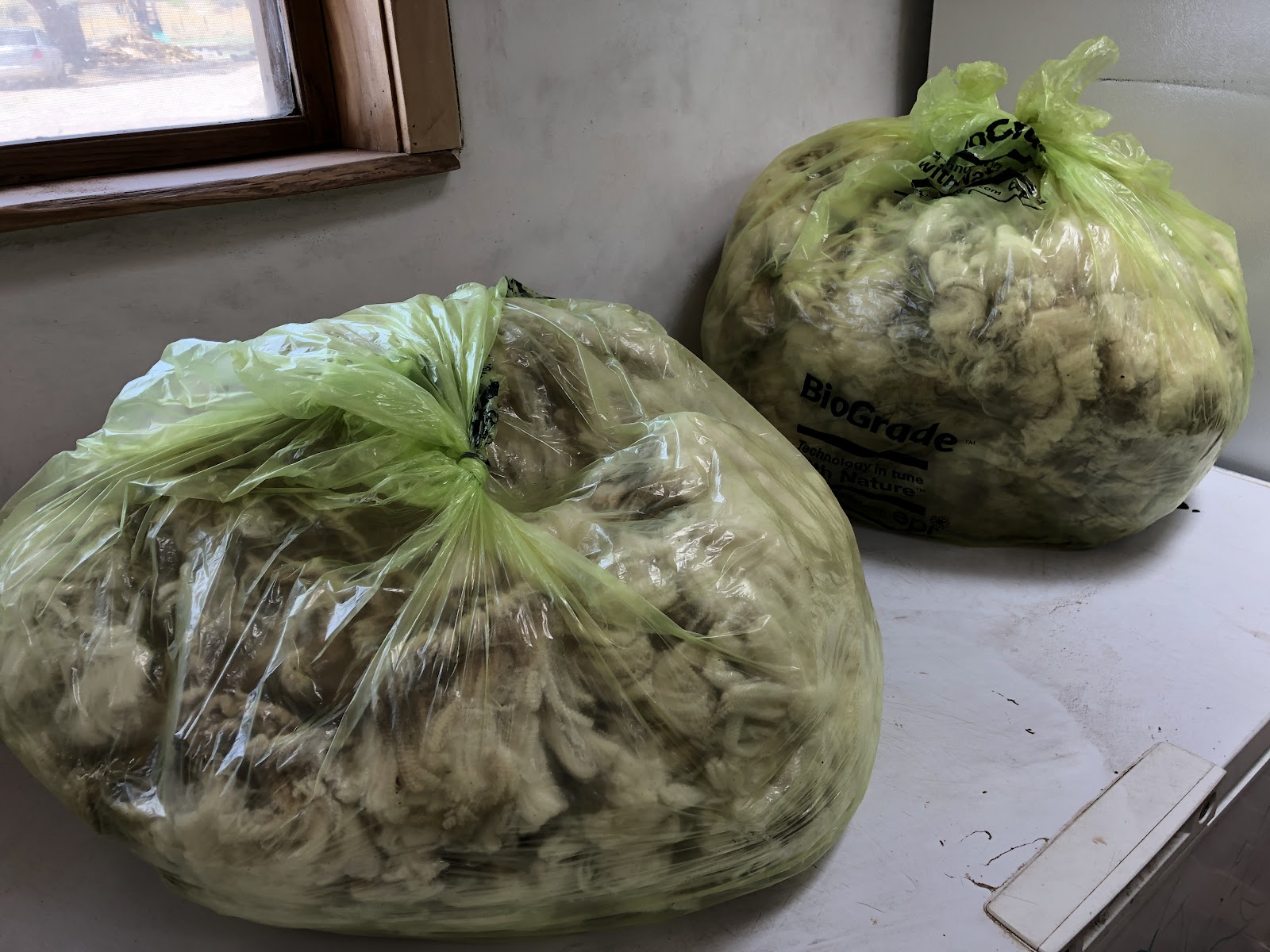 Bags of wool on table