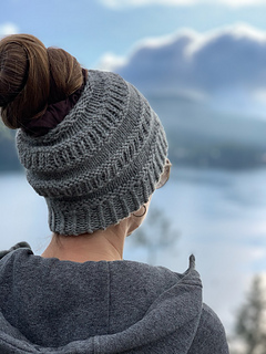 woman wearing gray messy bun beanie outside