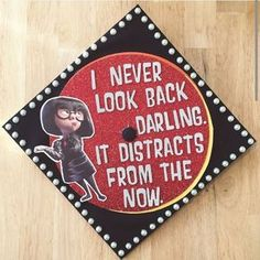 A graduation cap that reads "I never look back darling. It distracts from the now"