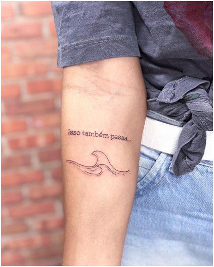 Full picture of the wave and quote tattoo