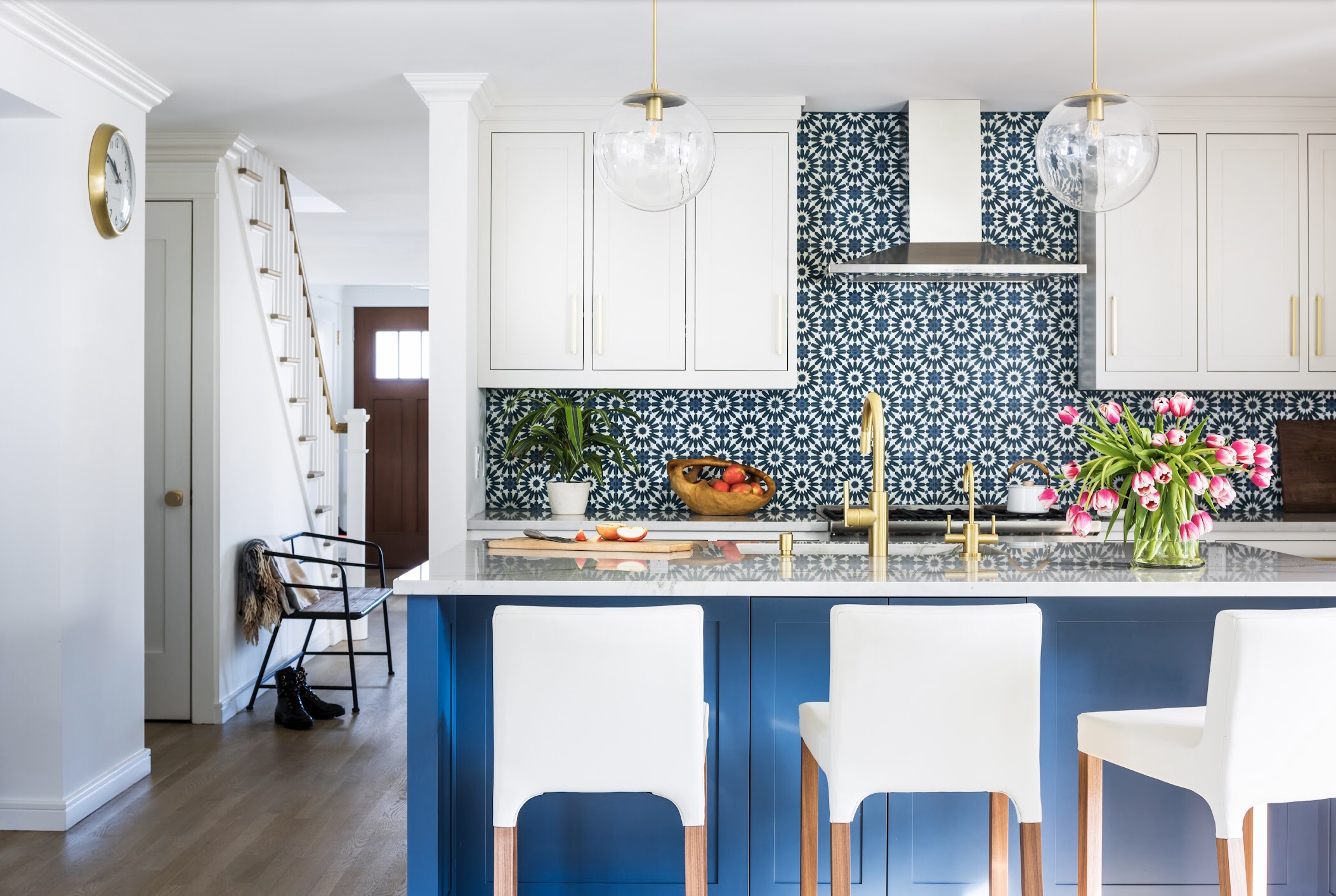 blue and white kitchen with dramatic tile backsplash