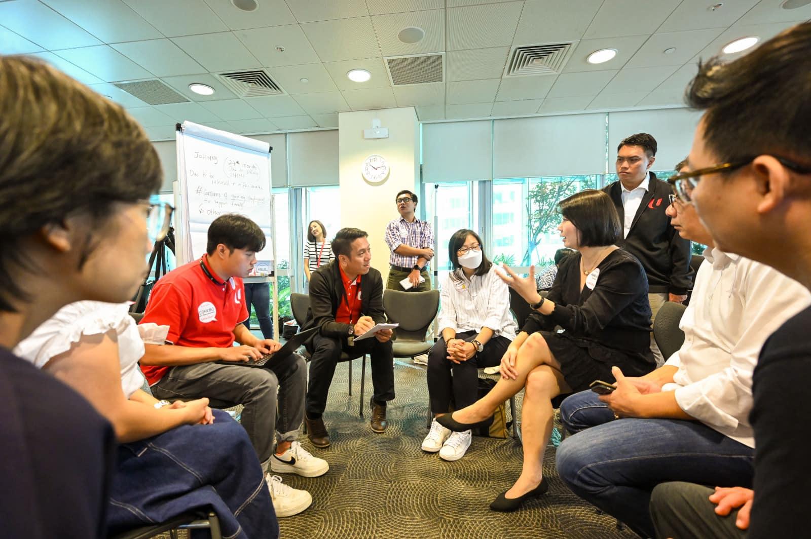 May be an image of 6 people, people sitting, people standing and indoor