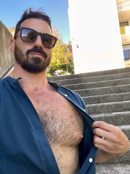 Thick Macho outside with his blue dress shirt unbuttoned to reveal his hairy pecs and nipple