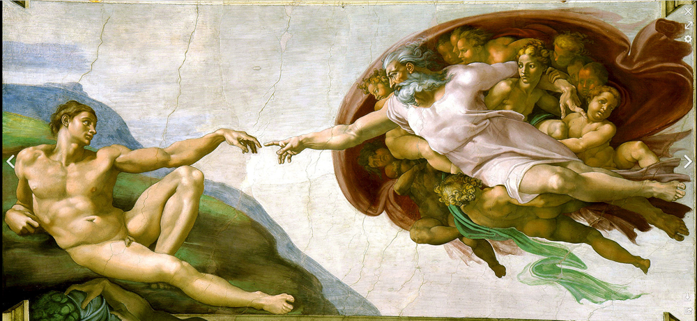 Photo of God creating Adam in the Sistine Chapel by artist Michelangelo.