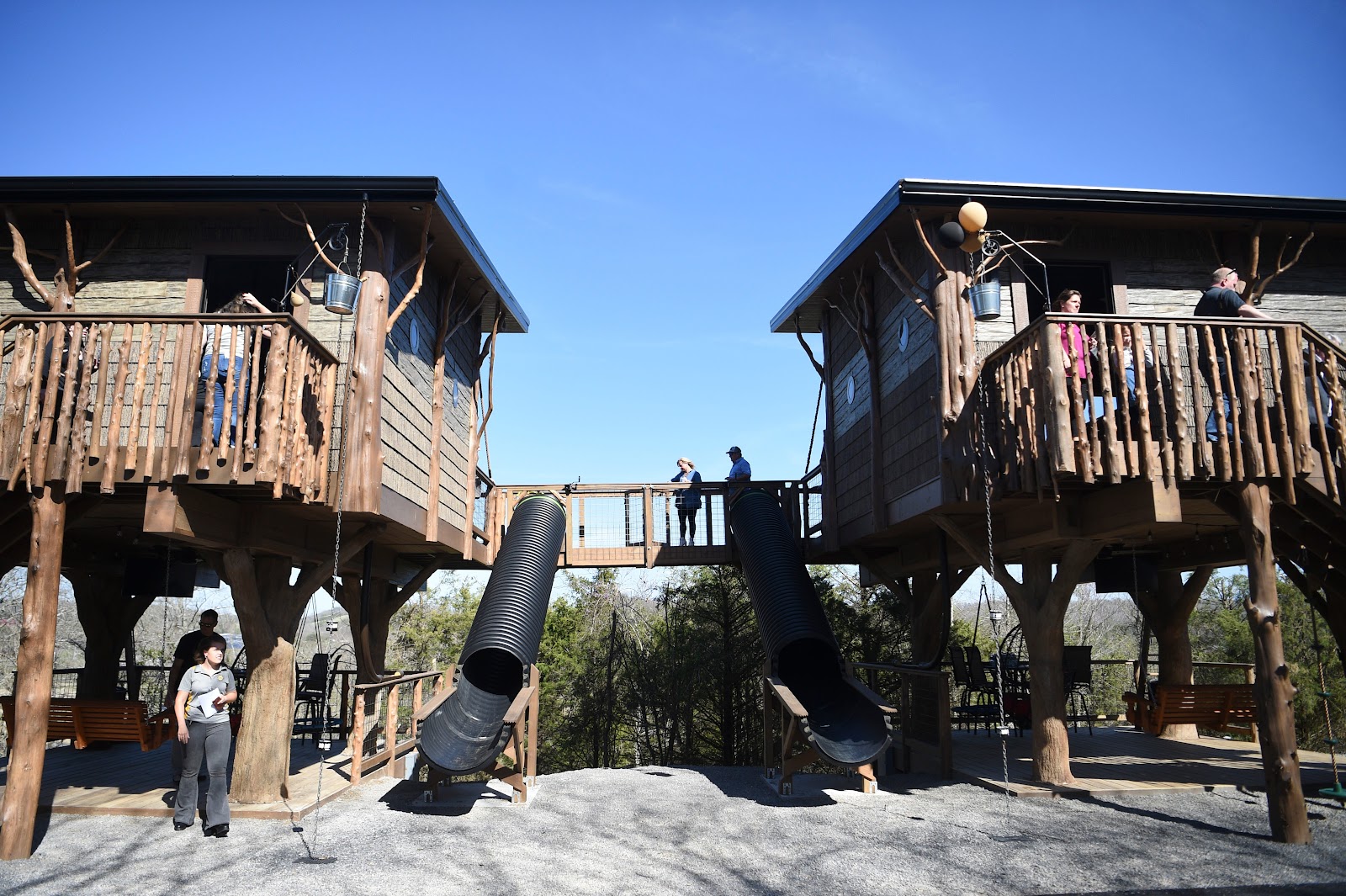 Two treehouses are connected, with slides in the middle, as seen at the ribbon cutting of Sanctuary Treehouse Resort in Sevierville, Monday, March 27, 2023.
