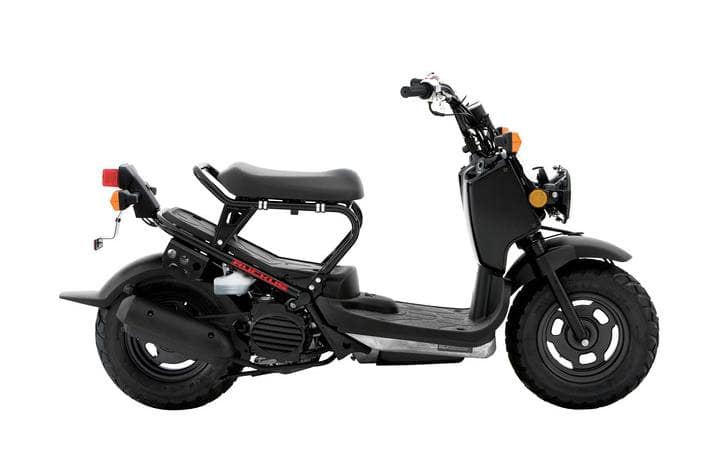 Black 2023 Honda Ruckus scooter highlighting its right side in a dealership showroom, recognized as the best Honda scooter of the year.