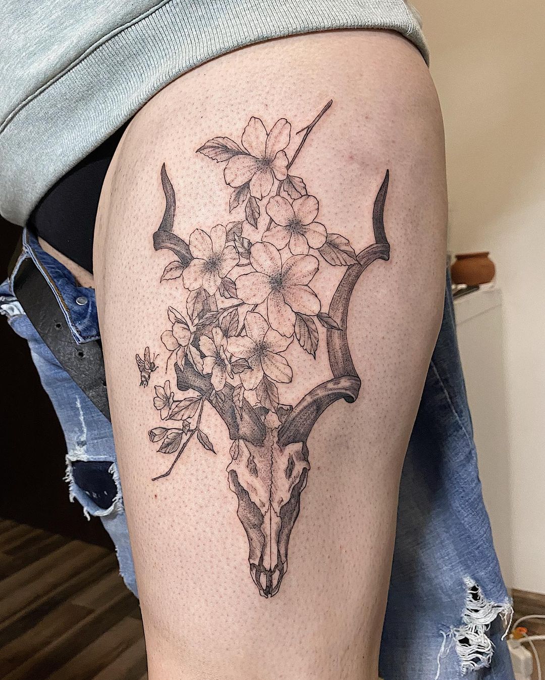 Grey Goat Skull And Flowers Thigh Tattoo