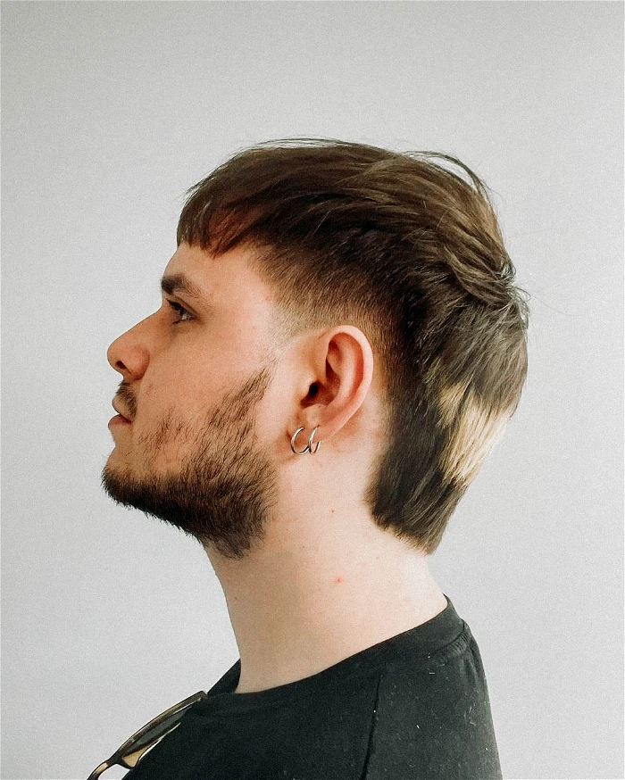 Full picture of a man rocking his hairdo with beards