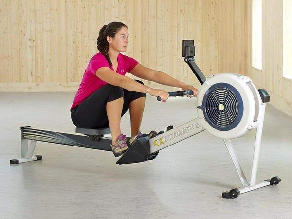 person using an at-home rowing machine -- best rowing machines