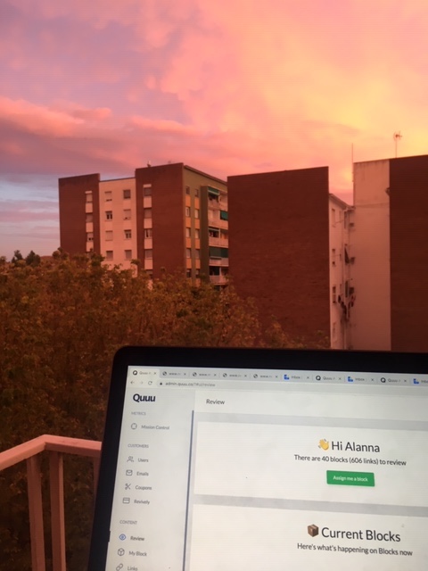 Remote working on a balcony during sunset
