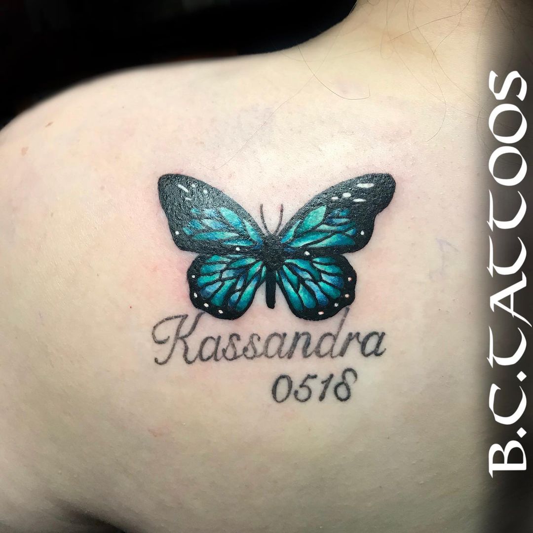 Blue Butterfly Tattoo On Back Shoulder