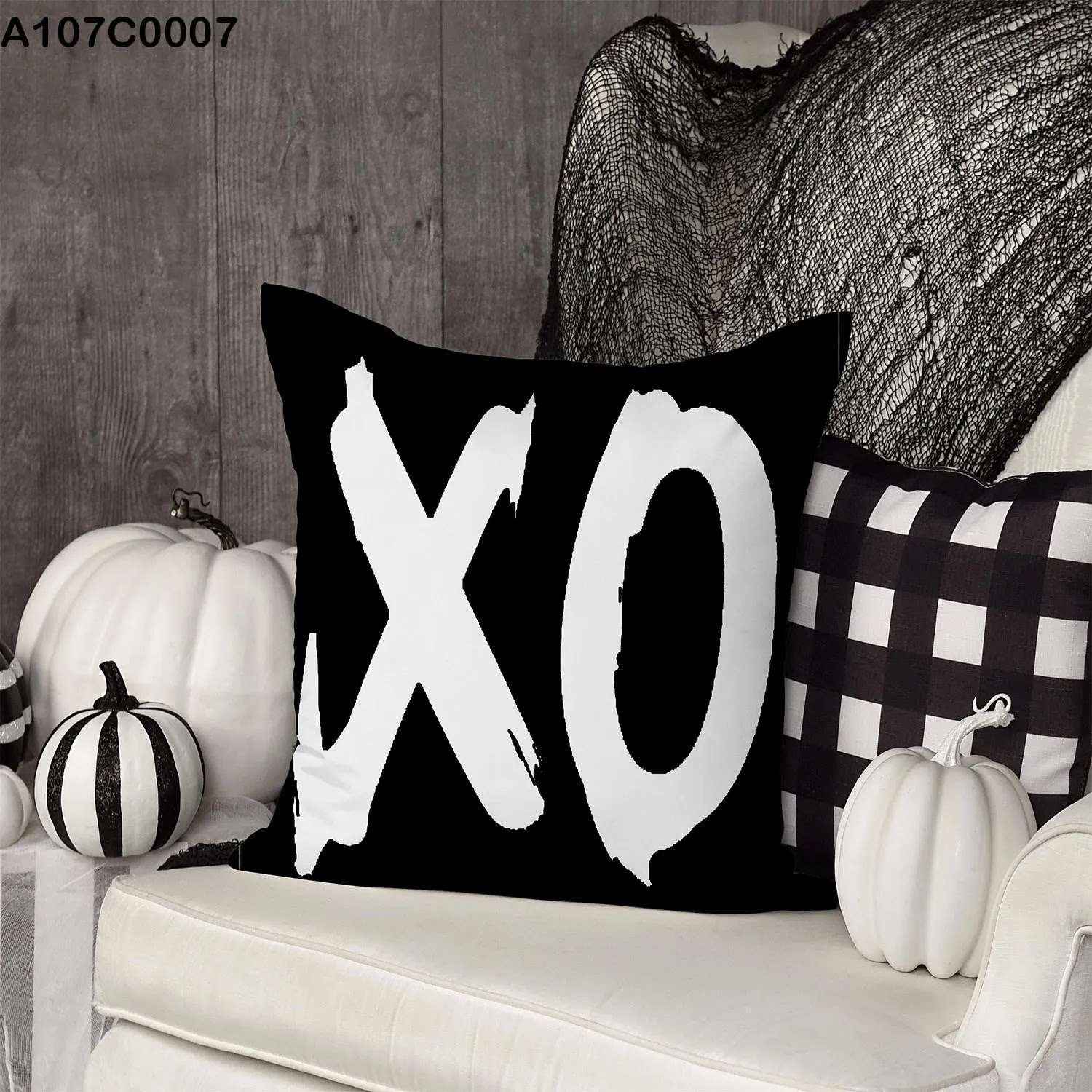 White and black pillow case with XO sign