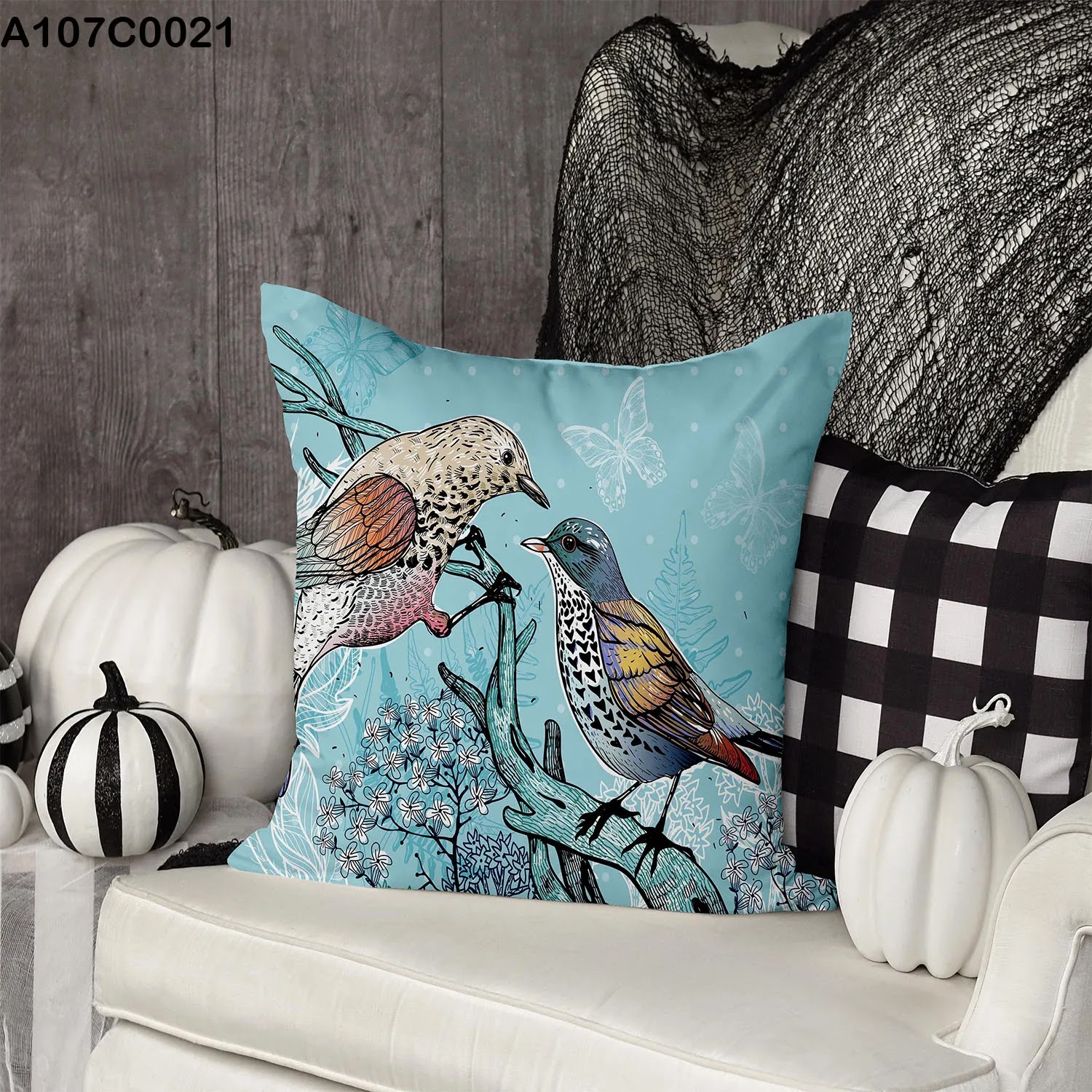 Light blue pillow case with two birds on a branch