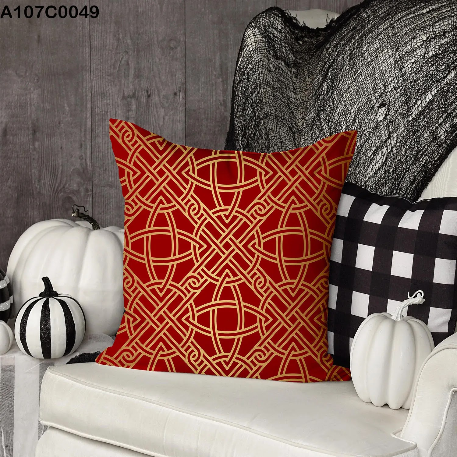 Red pillow case with gold lines and shapes