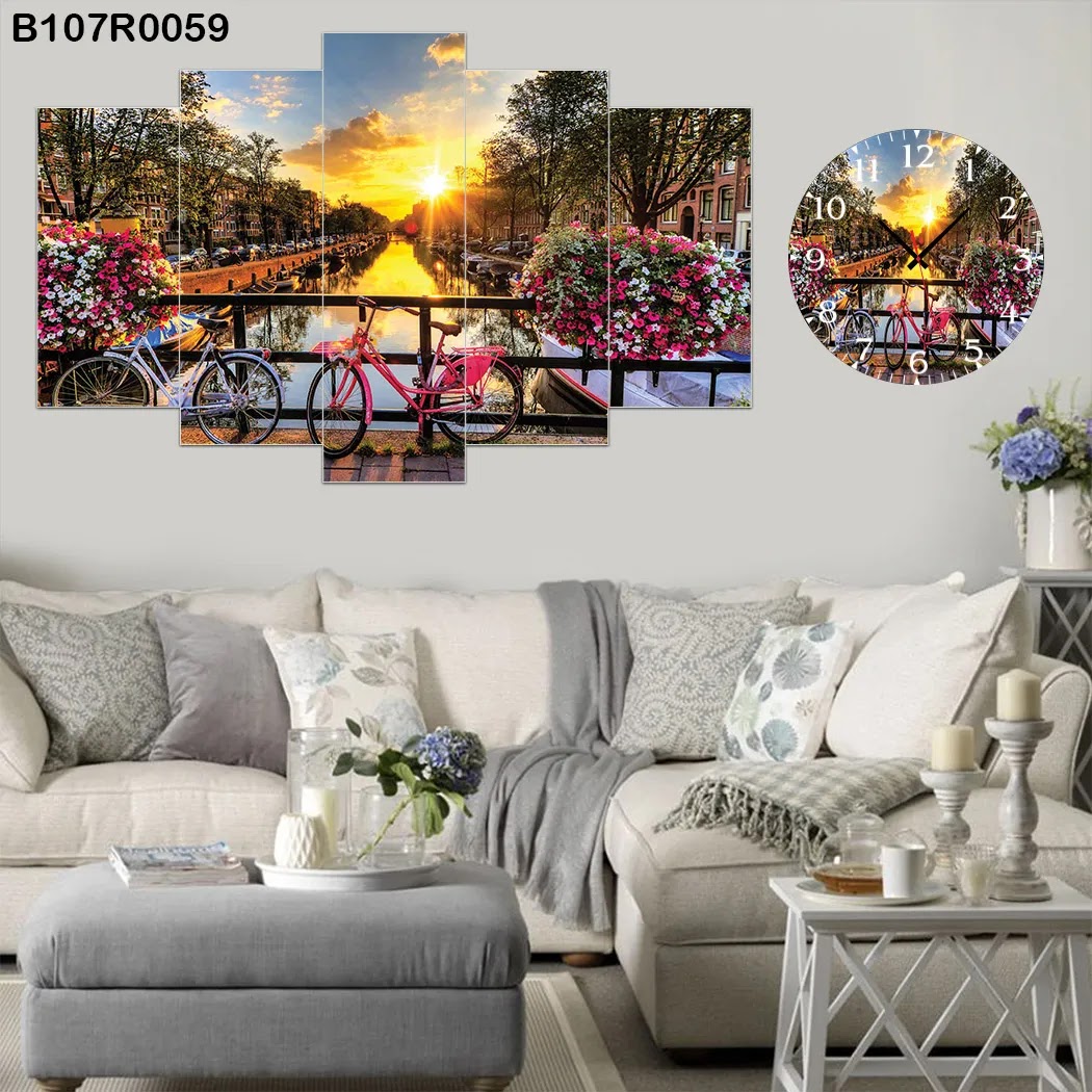A clock and Picture with the sunset and flowers view