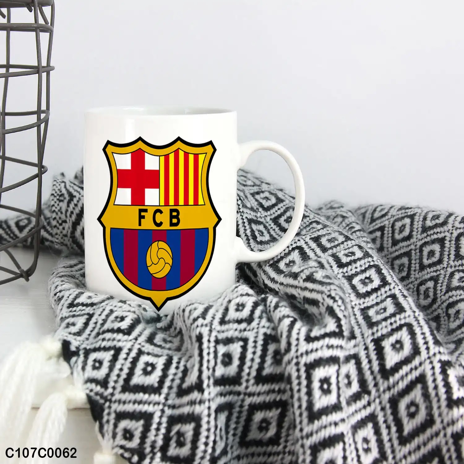 A mug (cup) printed with an image of a Barcelona logo