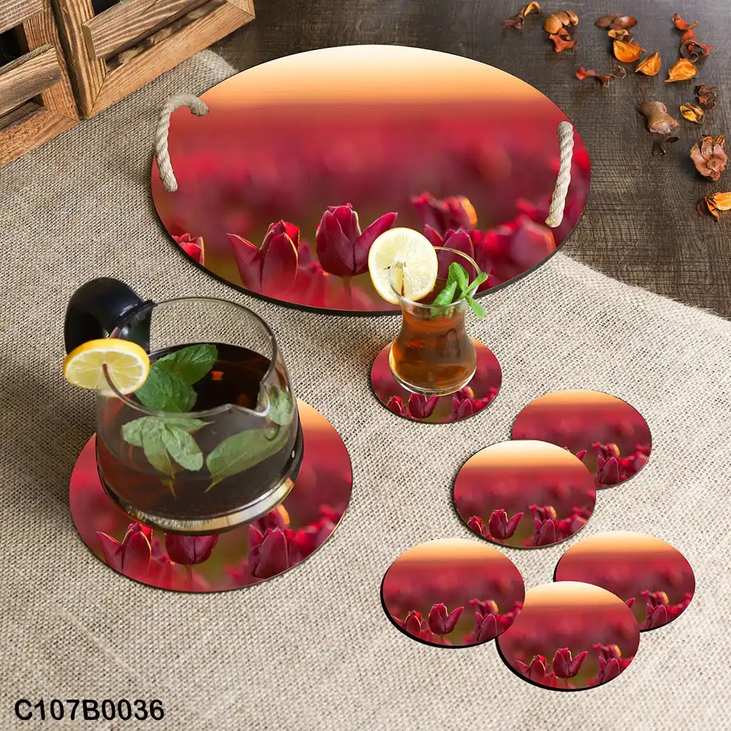 Circular tray set with red roses at sunset