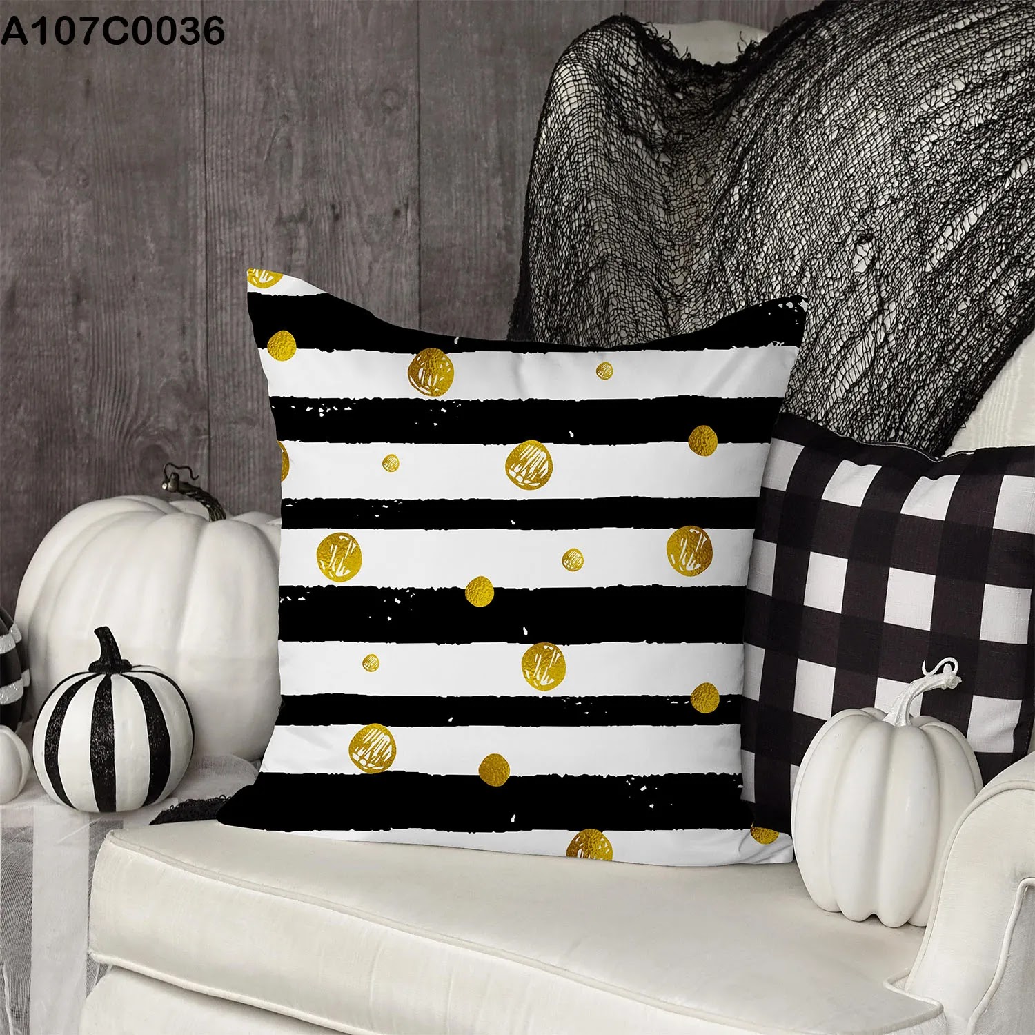 White and black striped pillow case with gold patches