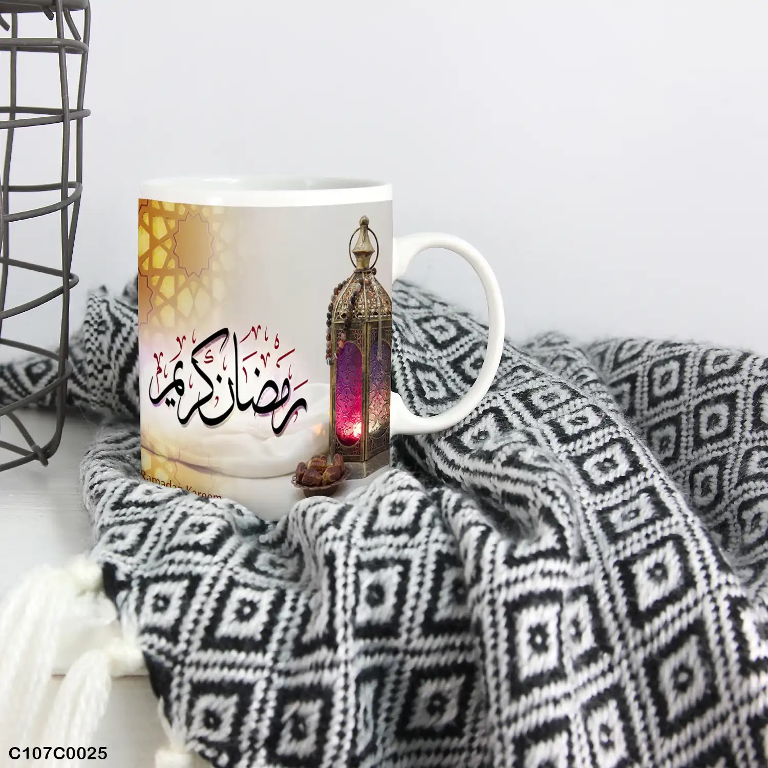 A white mug (cup) printed with "Ramadan Kareem" and lantern