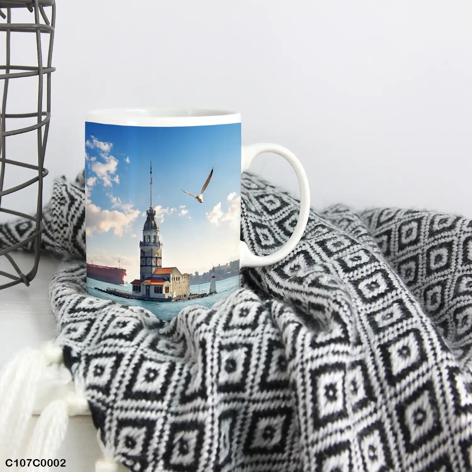 A mug (cup) printed with an image of Maiden tower and sea