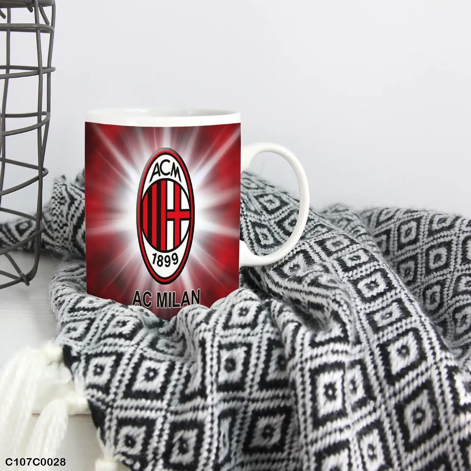 A mug (cup) printed with an image of a Milan logo