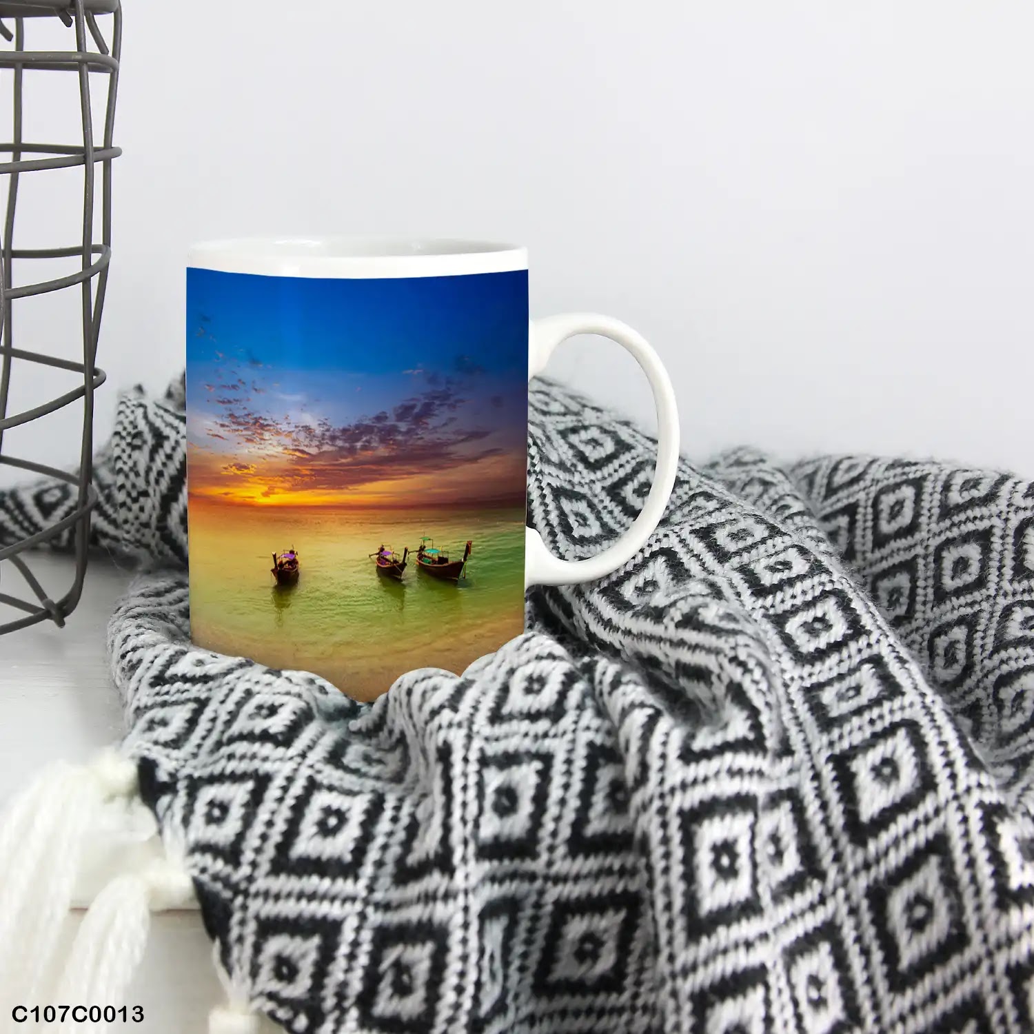 A mug (cup) printed with an image of boats at beach