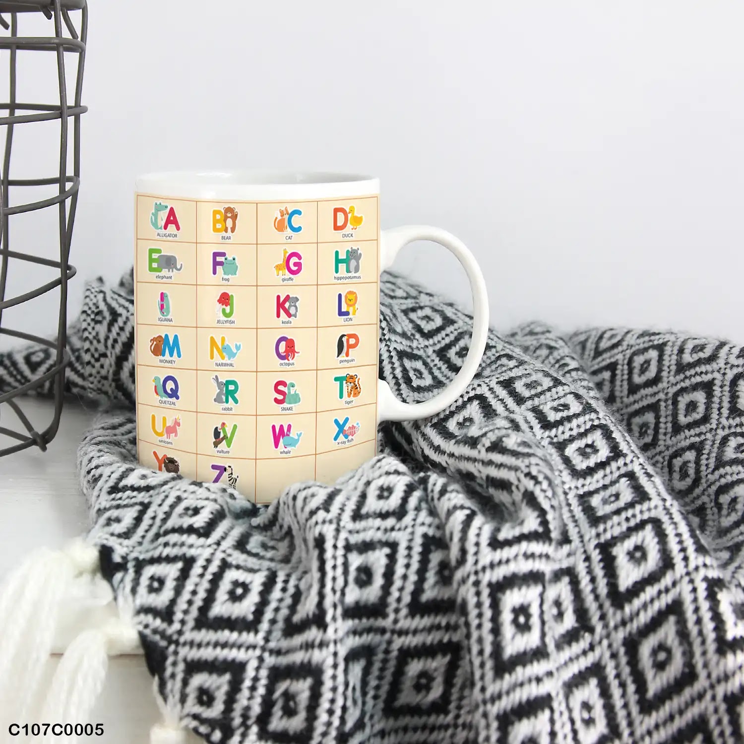 A mug (cup) printed with an English alphabet