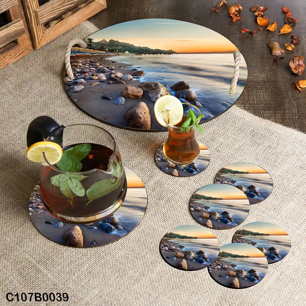 Circular tray set with pebbles and beach view