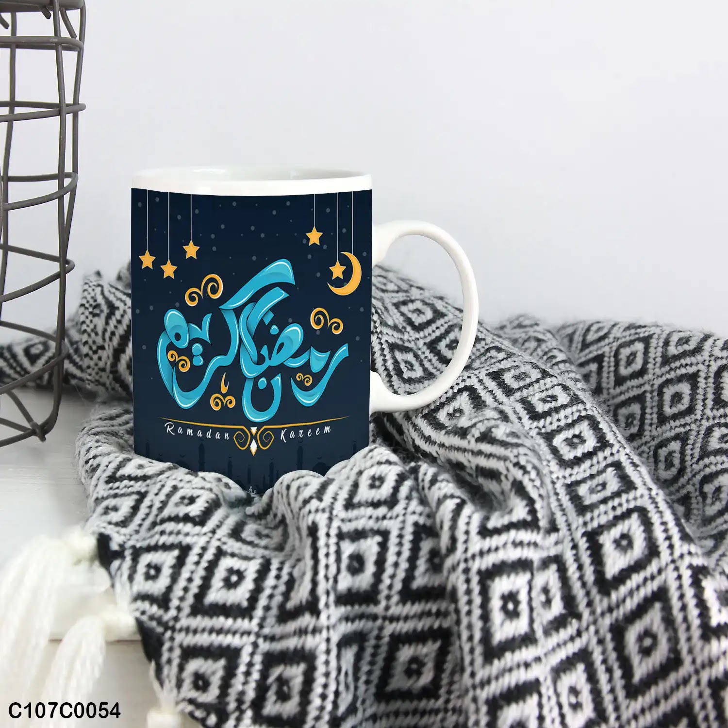 A light blue mug (cup) printed with "Ramadan Kareem" and lanterns
