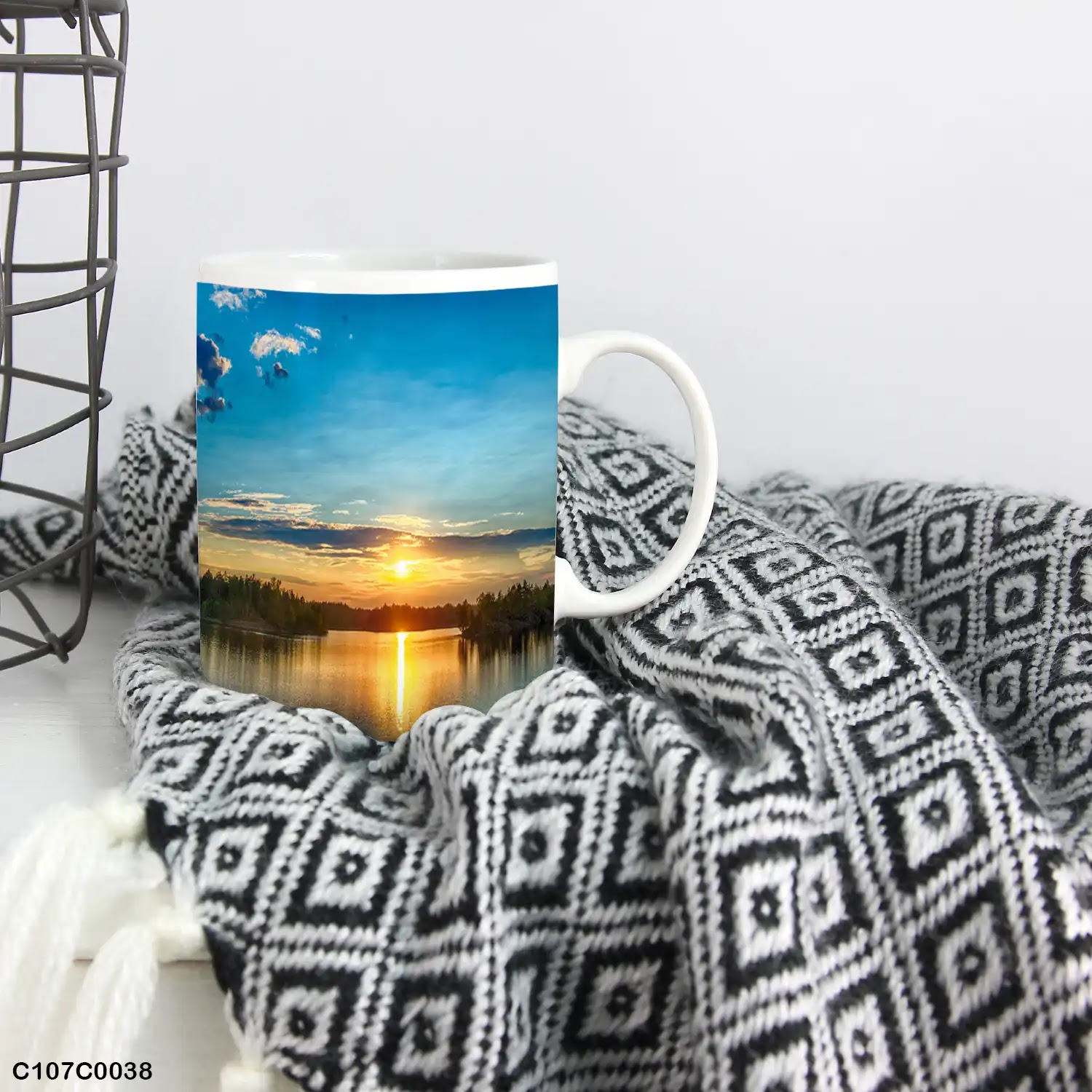 A mug (cup) printed with an image of a lake at sunset